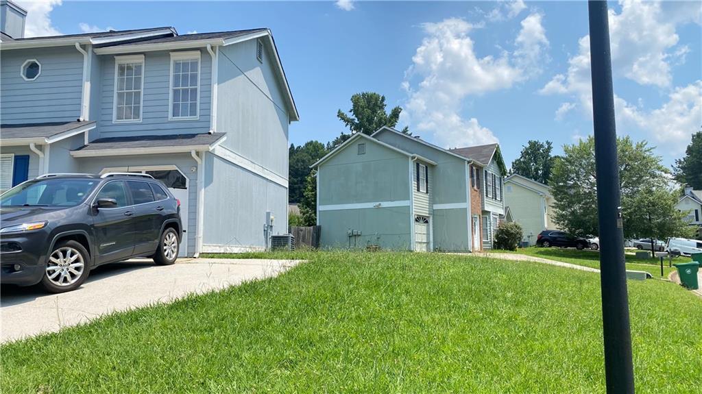 3791 Reston Lane Decatur, GA 30034 - Photo 2 of 20 a view of a house with a yard and garage
