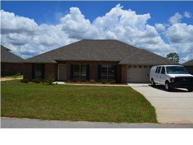 5254 Moore Loop Crestview, FL 32536 - Photo 1 of 13 a house view with a garden space