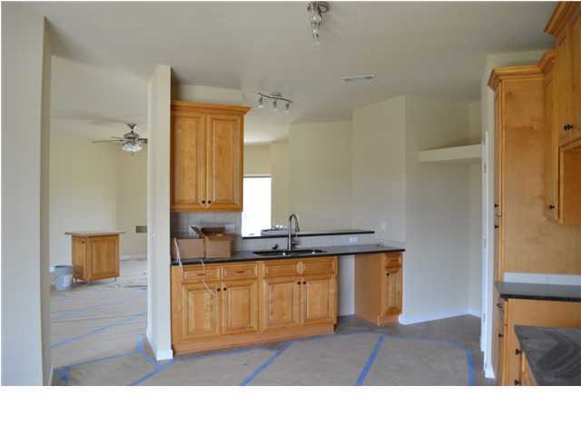 5254 Moore Loop Crestview, FL 32536 - Photo 5 of 13 a bathroom with a sink a mirror and a bathtub