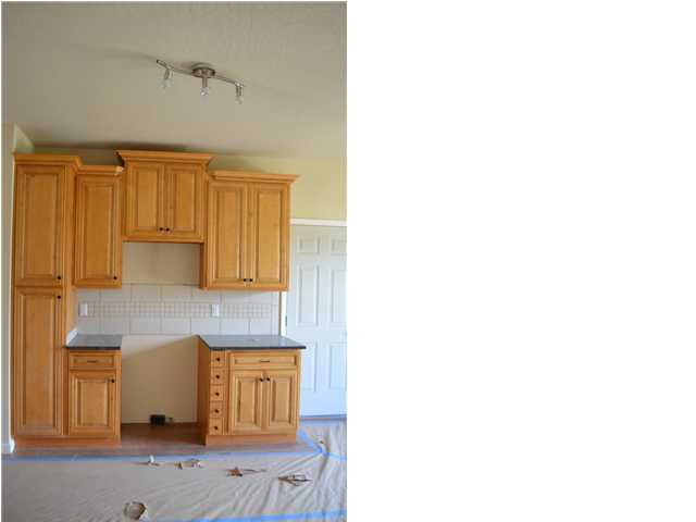 5254 Moore Loop Crestview, FL 32536 - Photo 6 of 13 a kitchen with a sink and cabinets
