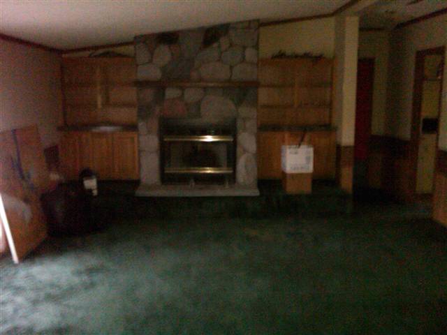 10145 Beckett Road Avoca, MI 48006 - Photo 5 of 19 This is a view of the living room and the fireplace.