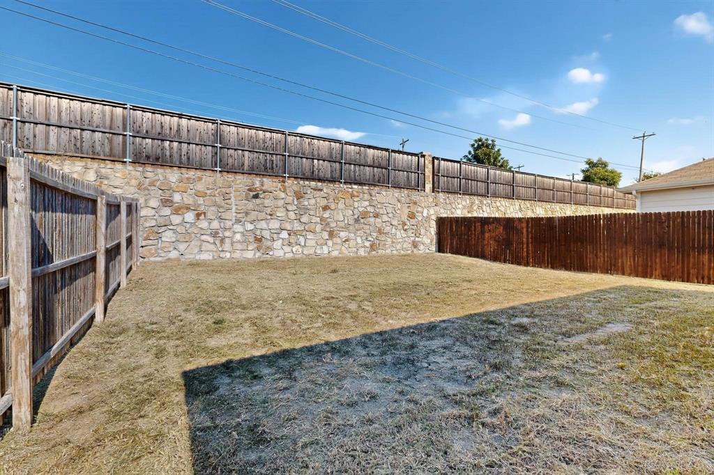 5516 McClelland Street Forney, TX 75126 - Photo 33 of 36 View of fenced backyard