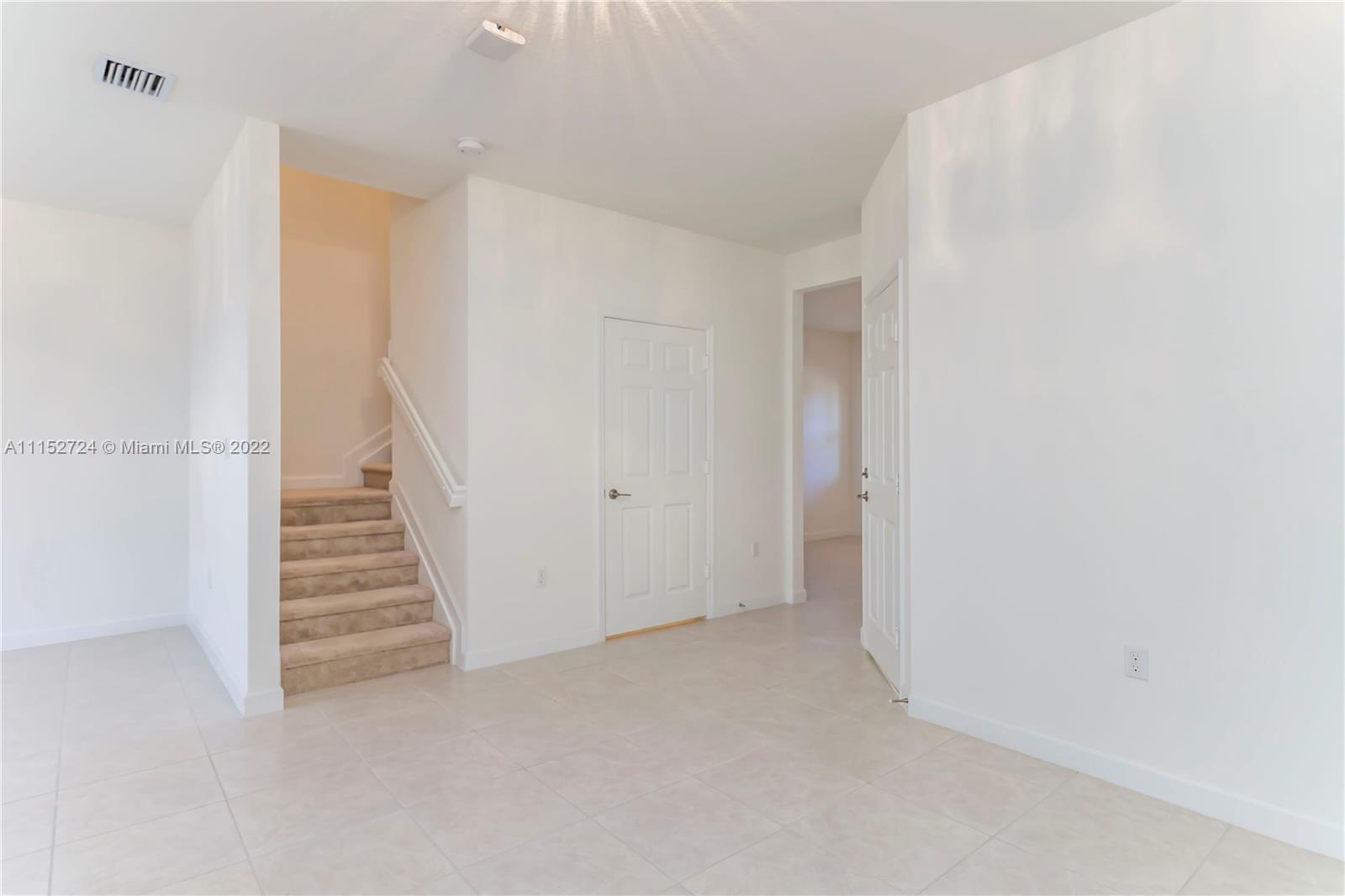 Davie Davie, FL 33314 - Photo 11 of 34 a view of an empty room with stairs