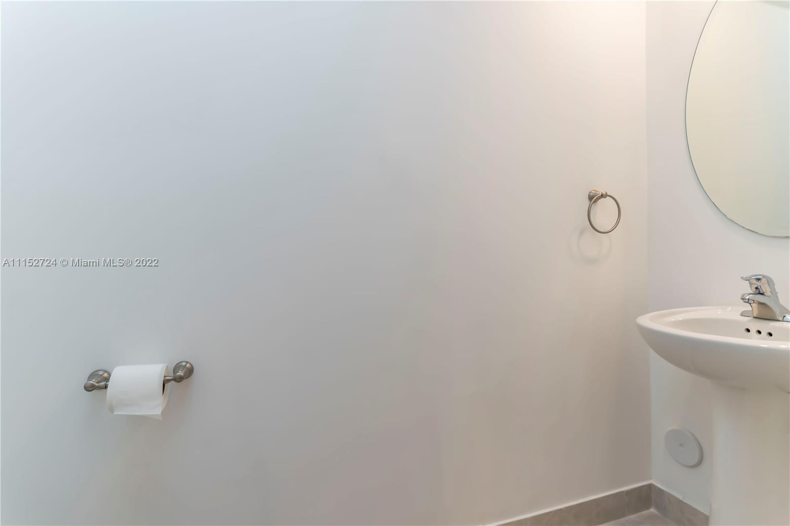 Davie Davie, FL 33314 - Photo 12 of 34 a bathroom with a sink and mirror