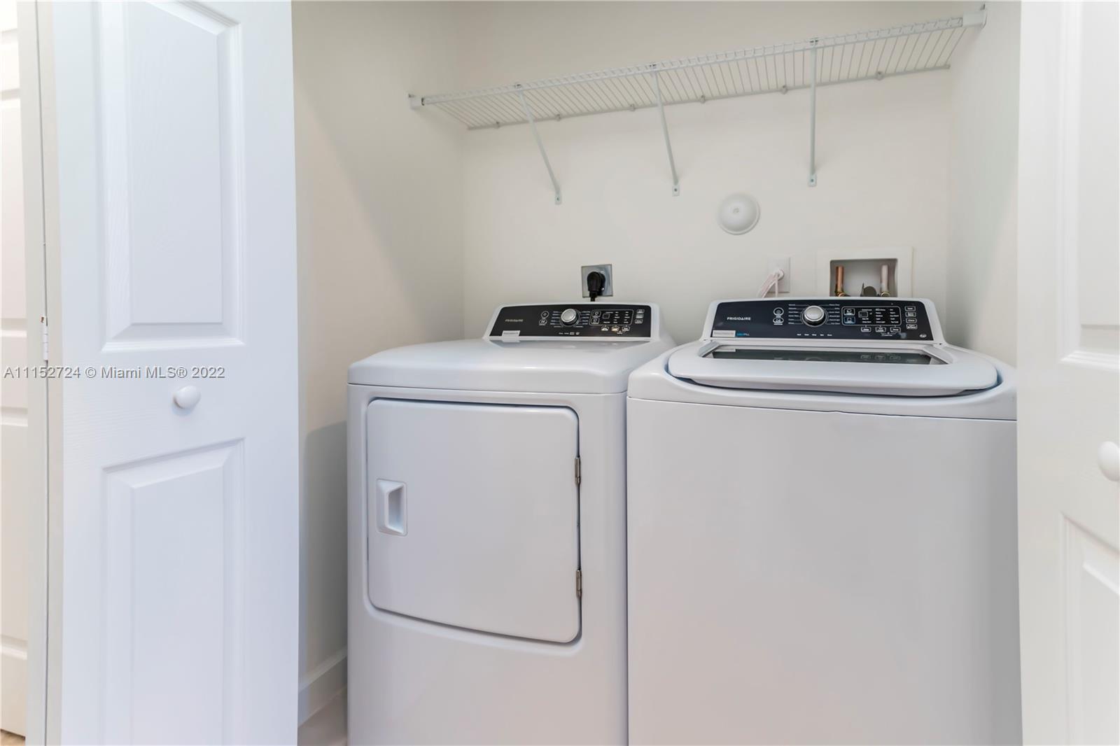Davie Davie, FL 33314 - Photo 19 of 34 a utility room with dryer and washer