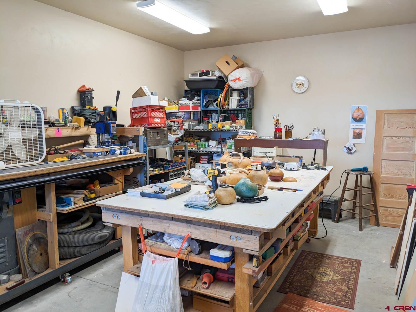 1244 Ash Mesa Road Delta, CO 81416 - Photo 29 of 35 a view of a dining room with furniture and a kitchen
