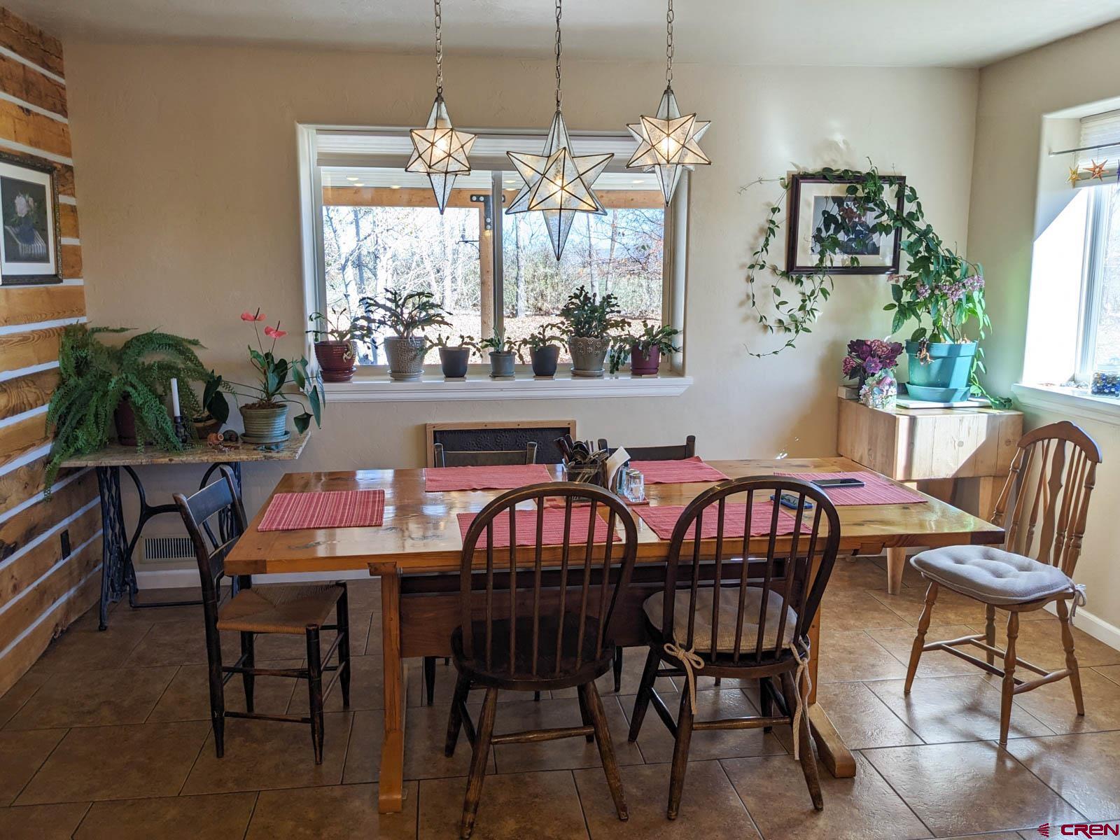 1244 Ash Mesa Road Delta, CO 81416 - Photo 5 of 35 a view of a dining room with furniture window and outside view