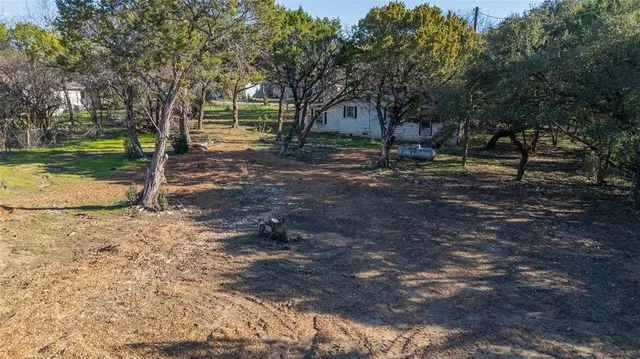 a backyard of a house with lots of green space