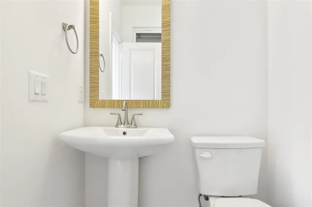 a bathroom with a sink and a toilet
