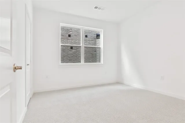 a bathroom with 2 sink toilet and a mirror