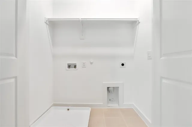 a view of a white house with a yard