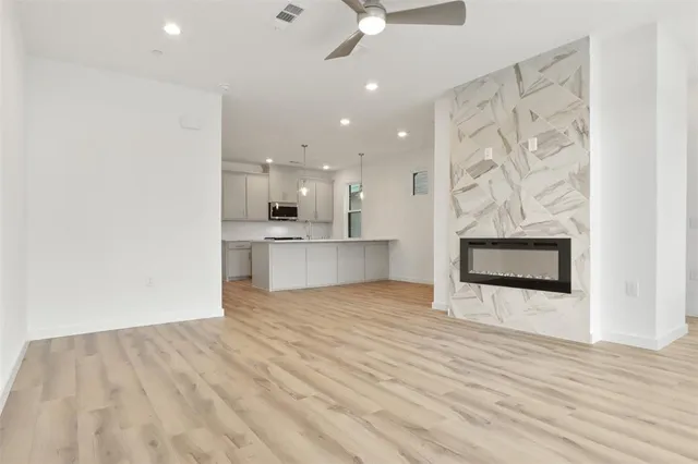 a view of a kitchen with a sink and a stove top oven