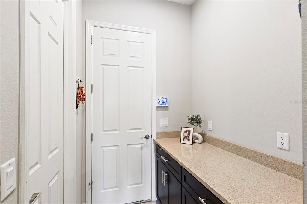 31976 Watoga Loop Wesley Chapel, FL 33543 - Photo 17 of 47 a room with a sink and cabinets