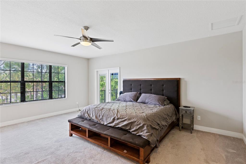 31976 Watoga Loop Wesley Chapel, FL 33543 - Photo 22 of 47 a bedroom with a bed and window