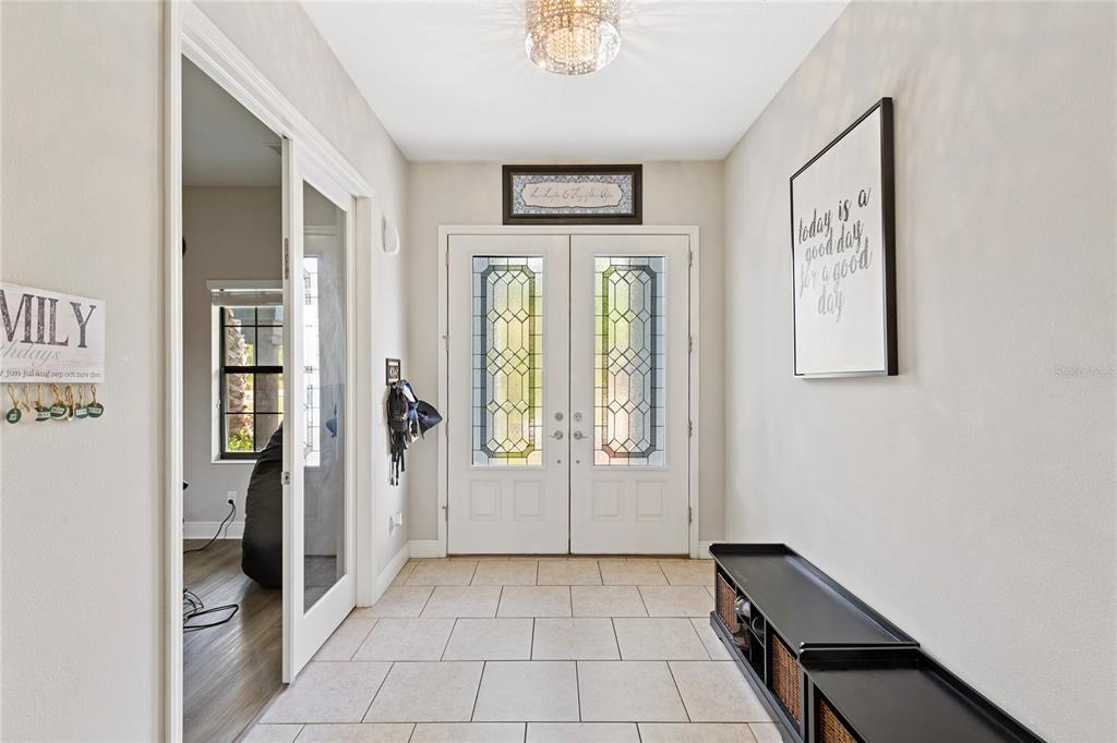 31976 Watoga Loop Wesley Chapel, FL 33543 - Photo 6 of 47 a view of an entryway with wooden floor