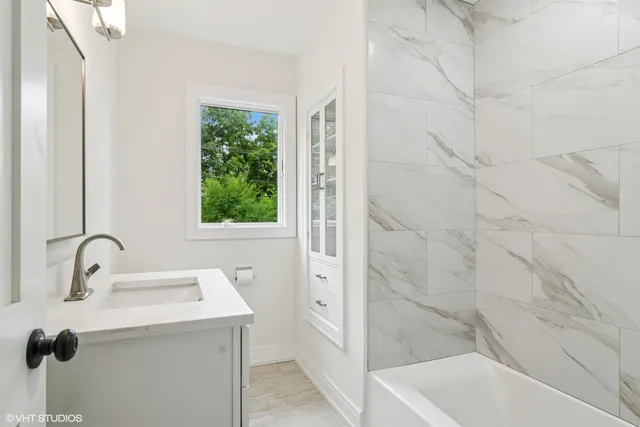 a bathroom with a sink and a bathtub