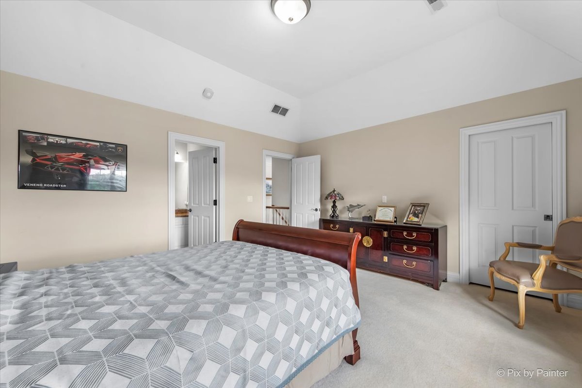 36W535 Hunters Gate Road St. Charles, IL 60175 - Photo 43 of 56 a bedroom with a bed and dresser