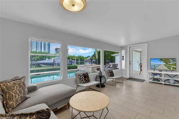 a living room with furniture and a large window