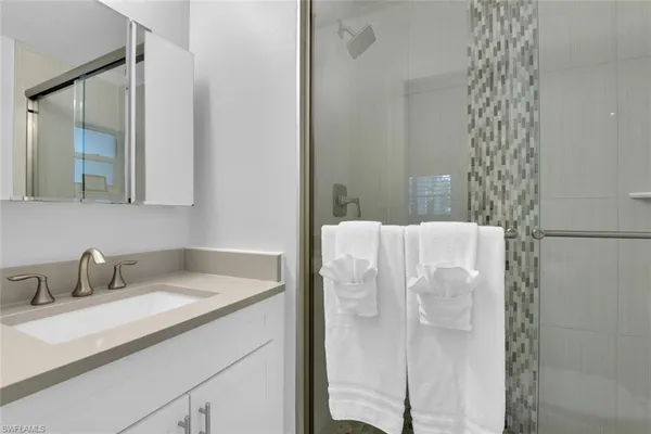 a bathroom with a sink and mirror