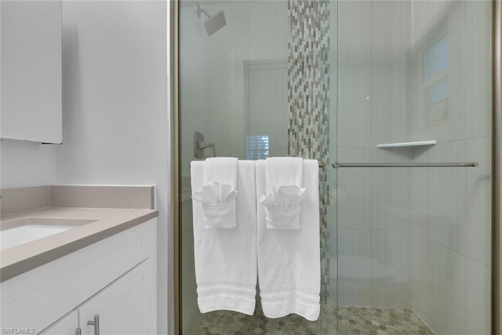 2048 Harbor Lane Naples, FL 34104 - Photo 17 of 35 a bathroom with a shower and a sink