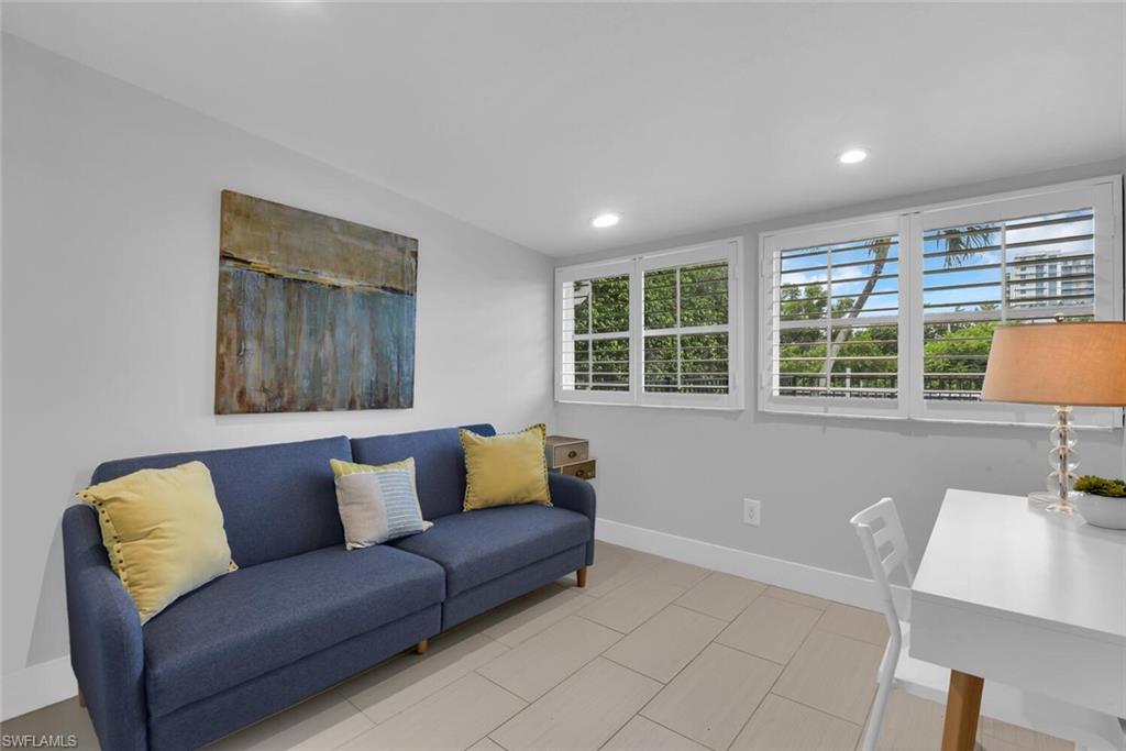 2048 Harbor Lane Naples, FL 34104 - Photo 23 of 35 a living room with furniture and a window
