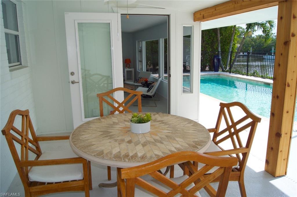 2048 Harbor Lane Naples, FL 34104 - Photo 25 of 35 a view of a dining room with furniture window and outside view
