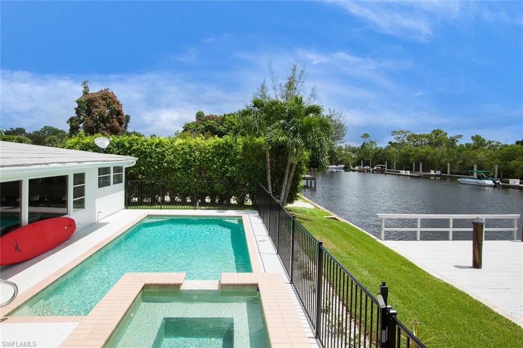 2048 Harbor Lane Naples, FL 34104 - Photo 27 of 35 a view of yard with swimming pool and seating