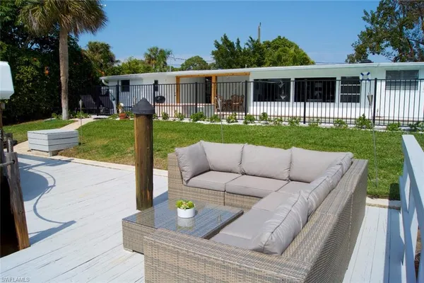 a view of a house with a backyard