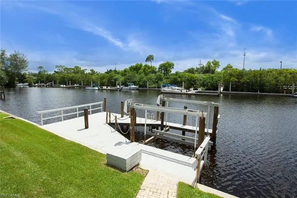a view of a lake with houses in the back
