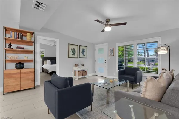 a living room with furniture and a window