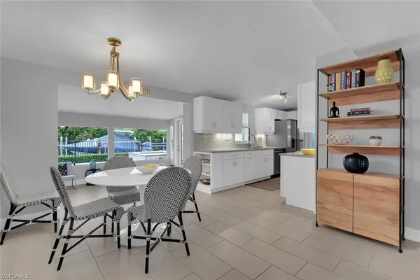 a view of a dining room with furniture window and outside view
