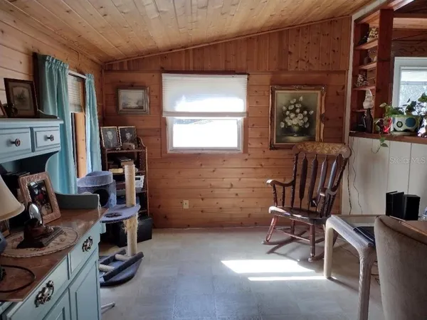a view of a room with workspace and windows