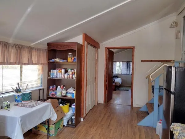 a living room with furniture fireplace and a window