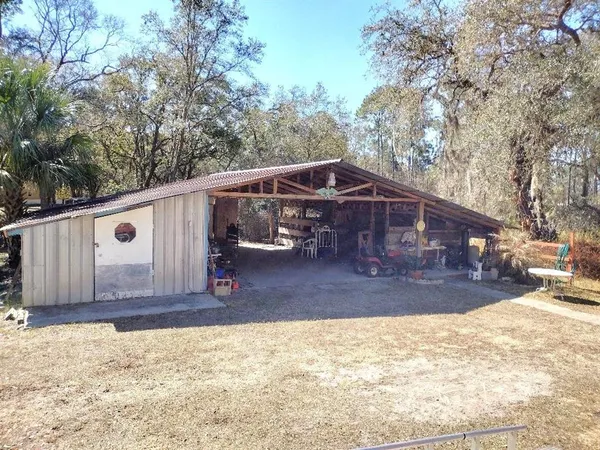 a kitchen with stainless steel appliances granite countertop lots of clutter