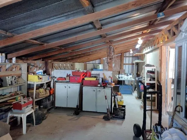 a view of a house with a yard covered in snow