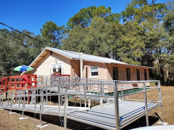 a view of a yard with trees