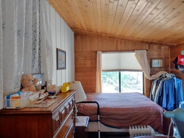 a bed room with furniture and a window