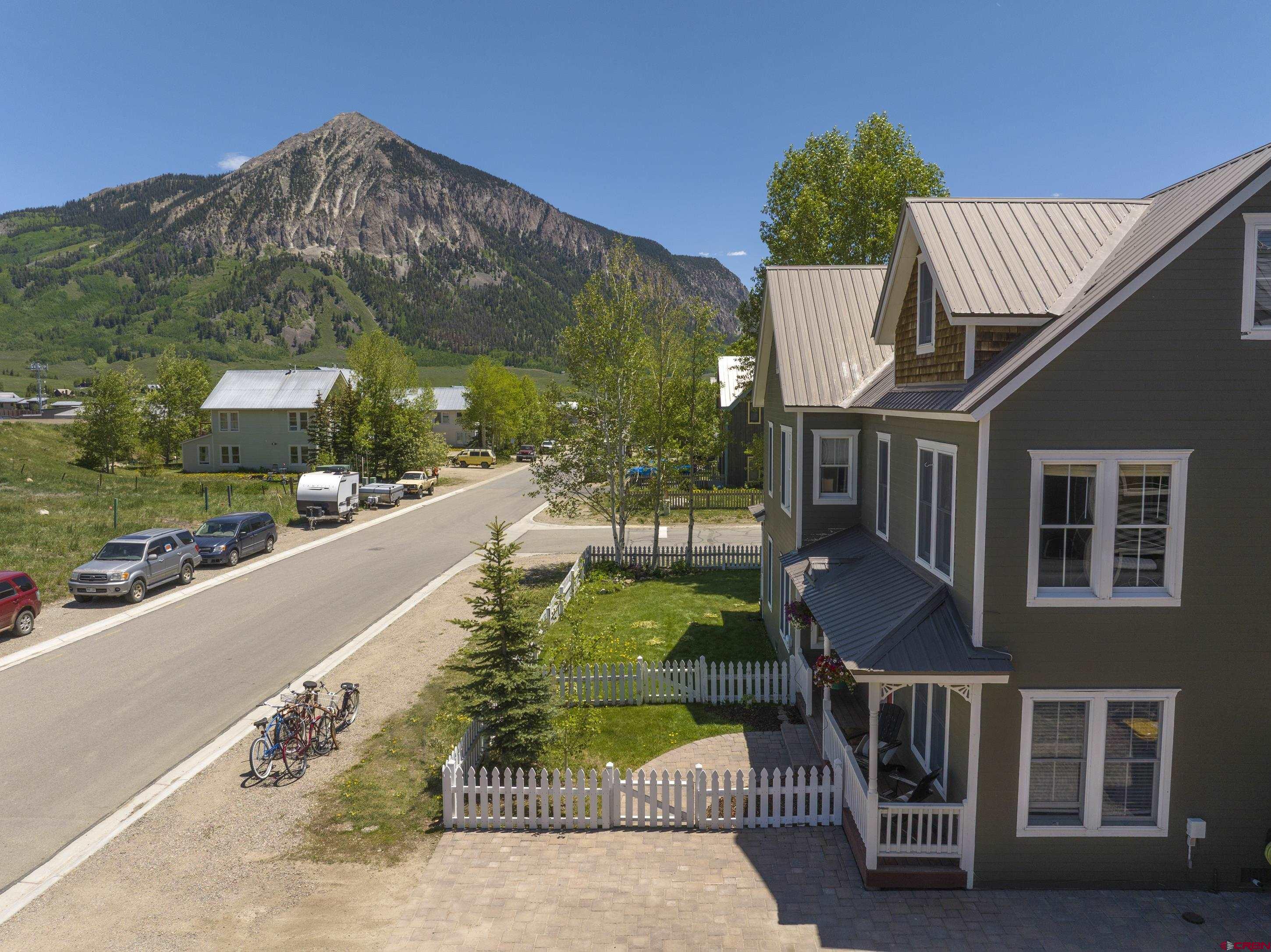 1 7th Street, Unit B Crested Butte, CO 81224 - Photo 2 of 35 a view of a house with backyard and sitting area