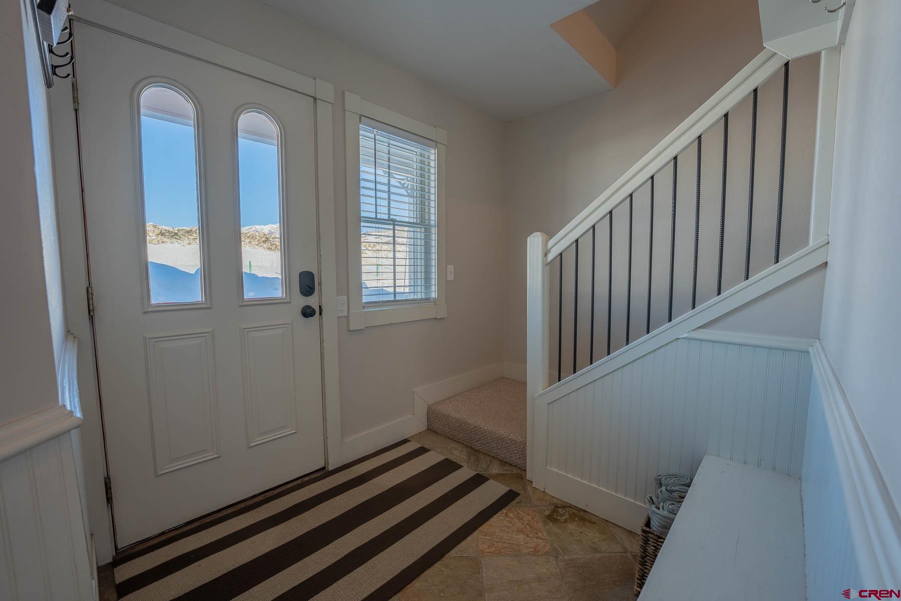 1 7th Street, Unit B Crested Butte, CO 81224 - Photo 21 of 35 a view of a livingroom with wooden floor and staircase