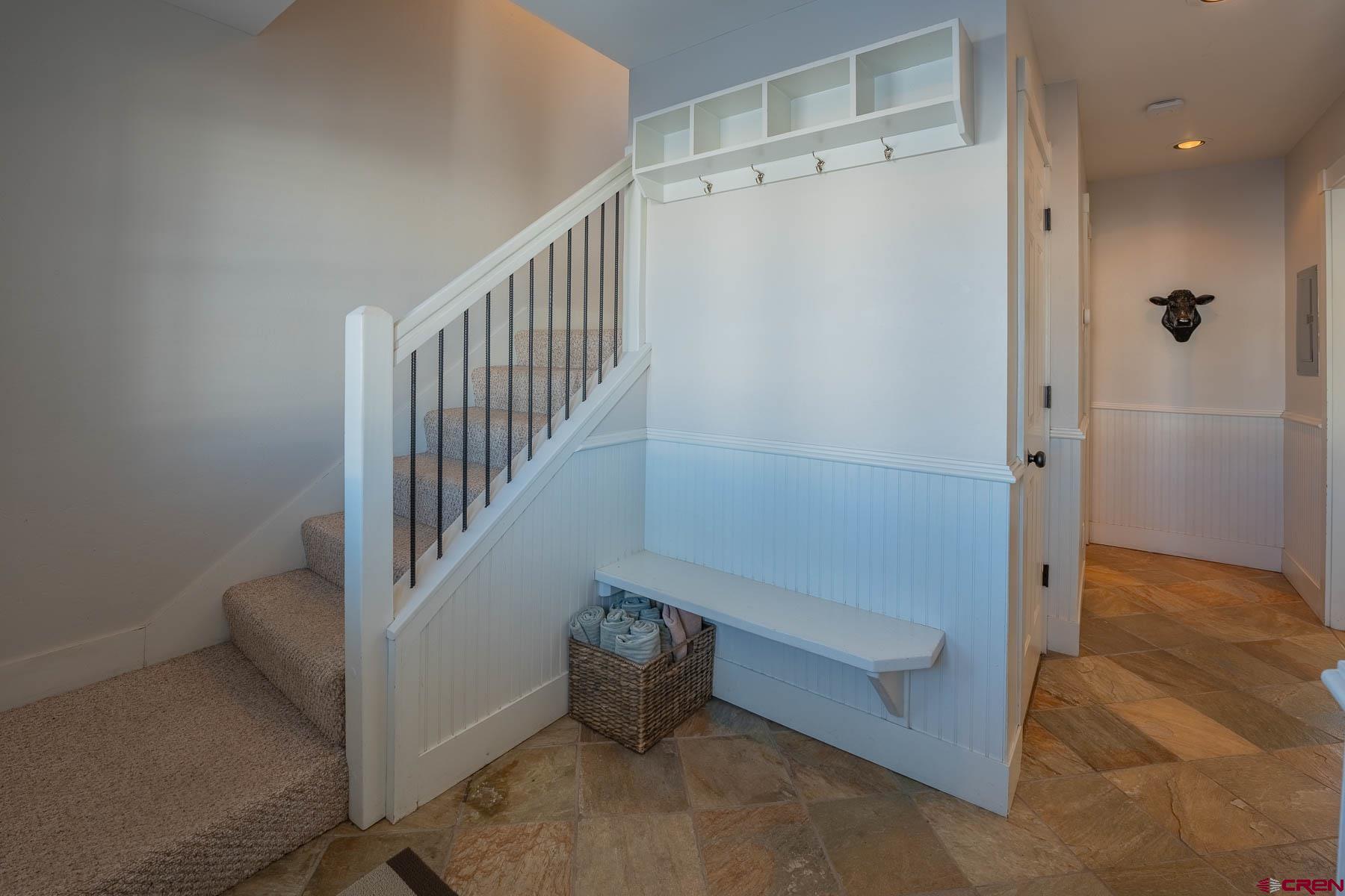 1 7th Street, Unit B Crested Butte, CO 81224 - Photo 22 of 35 a view of entryway with stairs and furniture