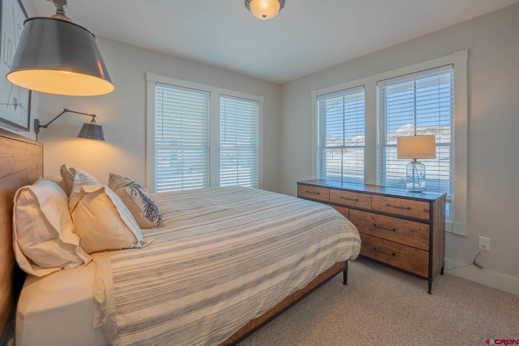 1 7th Street, Unit B Crested Butte, CO 81224 - Photo 23 of 35 a bedroom with a bed and a window
