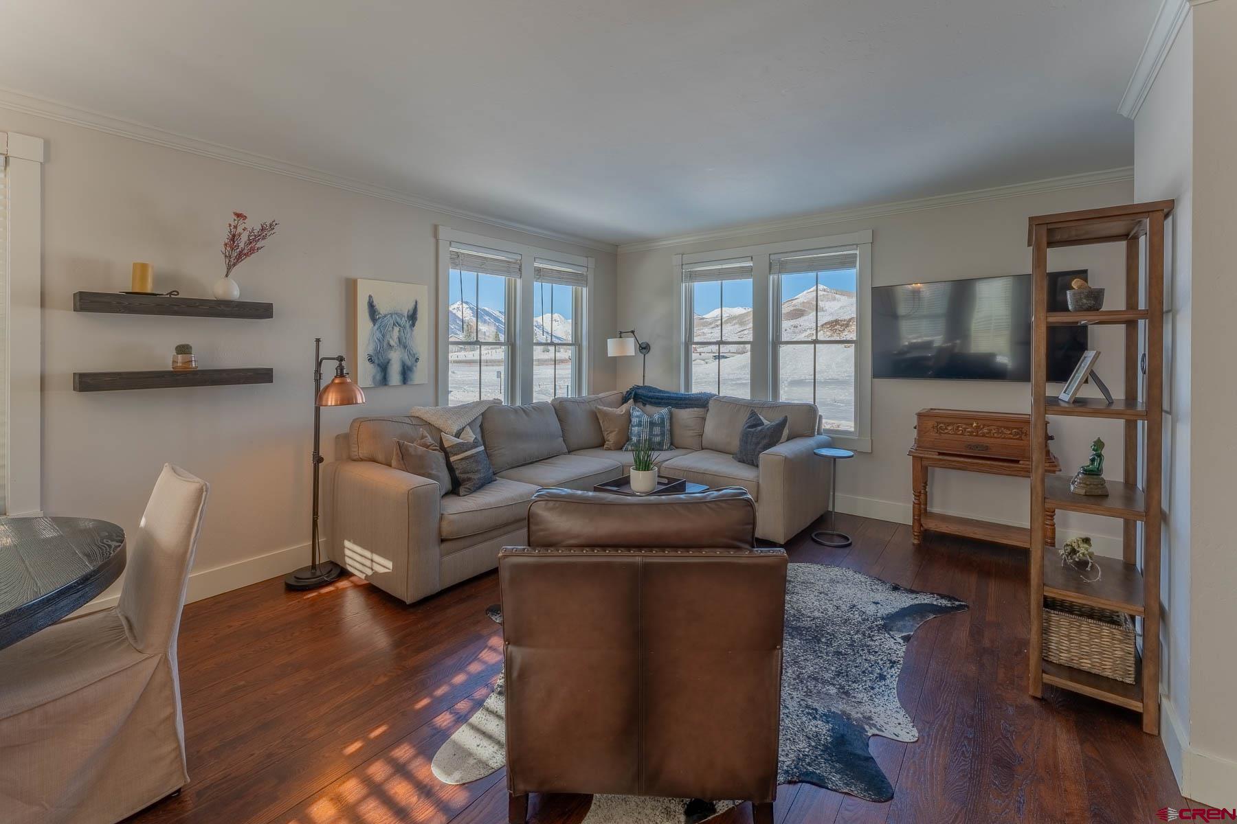 1 7th Street, Unit B Crested Butte, CO 81224 - Photo 5 of 35 a living room with furniture a wooden floor and a window