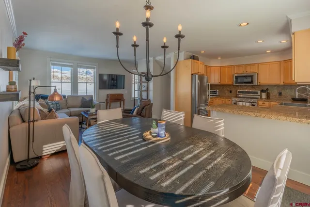 a living room with dining table