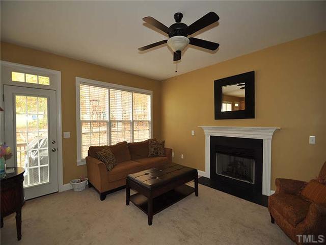 5325 Indigo Moon Way Raleigh, NC 27613 - Photo 5 of 13 The beautiful family room features 9 foot ceilings, large windows offering natural light, and fireplace.
