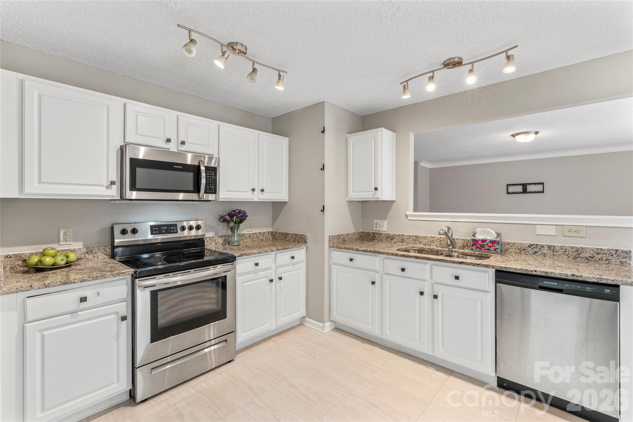 4208 Shasta Circle Clover, SC 29710 - Photo 22 of 41 a kitchen with granite countertop white cabinets white stainless steel appliances and sink