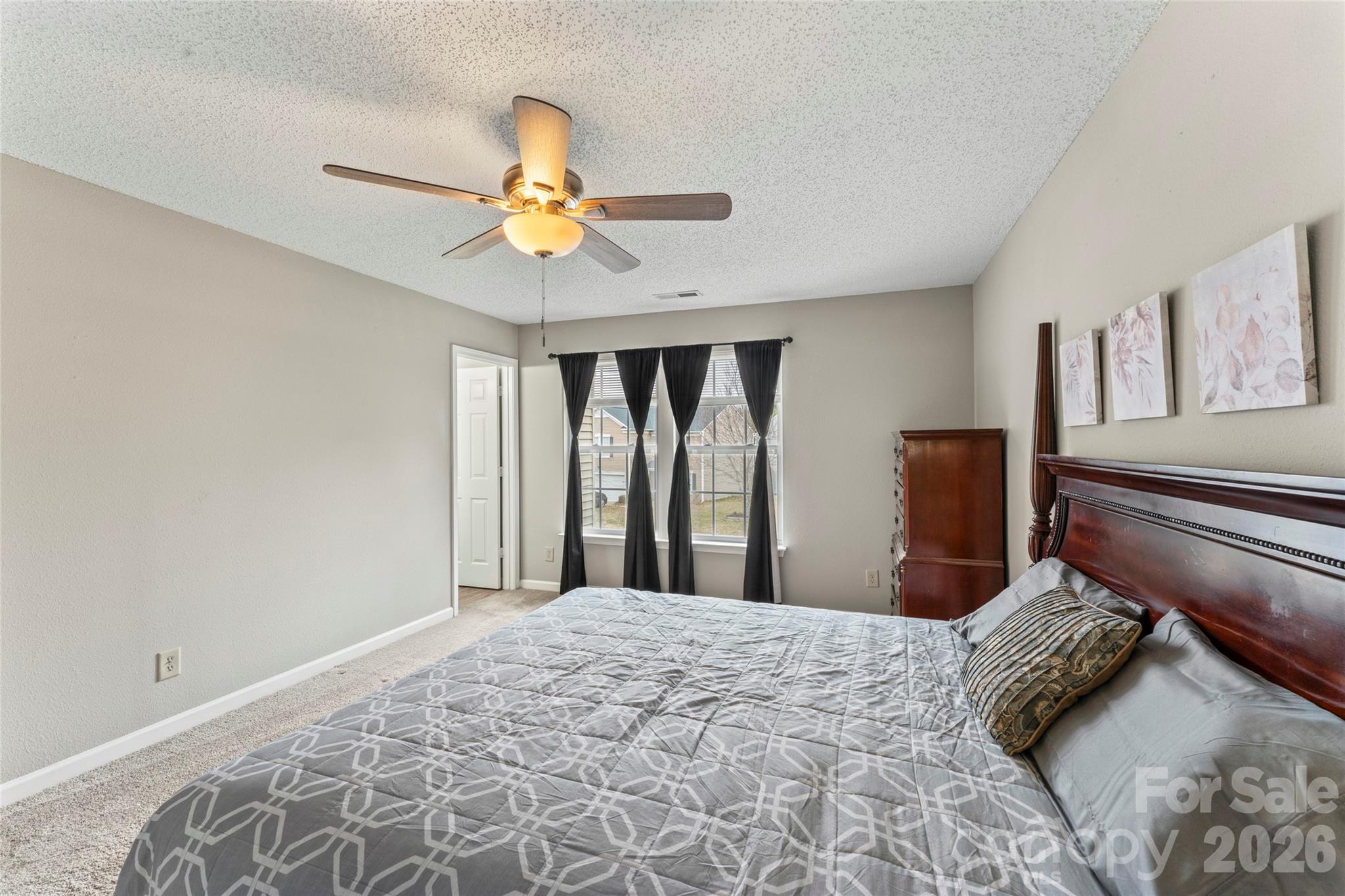 4208 Shasta Circle Clover, SC 29710 - Photo 31 of 41 a bedroom with a bed and a chandelier
