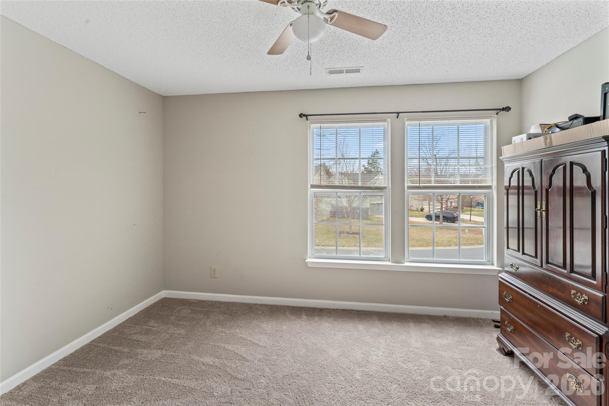 4208 Shasta Circle Clover, SC 29710 - Photo 36 of 41 an empty room with chandelier fan and windows
