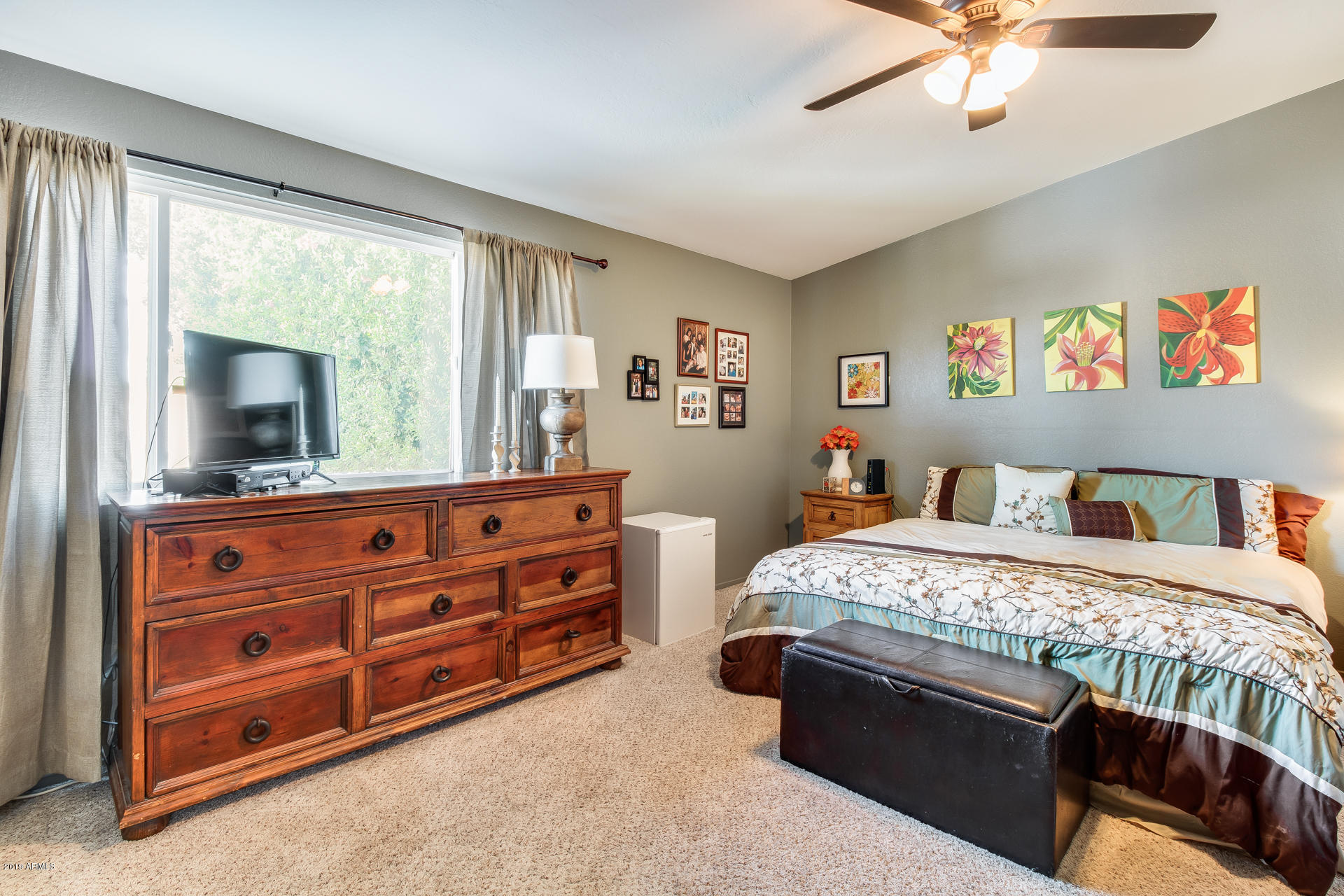 5615 South Crows Nest Road Tempe, AZ 85283 - Photo 19 of 44 a bedroom with a bed and a dresser in it
