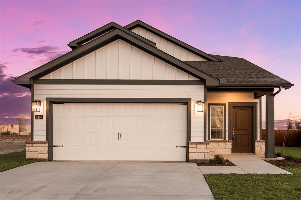 264 Sutter Mill Road Saginaw, TX 76131 - Photo 4 of 24 a front view of a house with garden