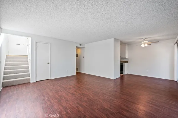 a kitchen with a sink and a refrigerator